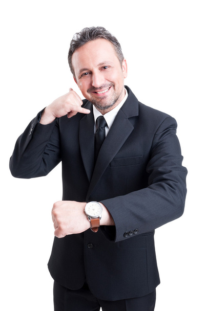 Uomo d'affari che mostra orologio e mi chiama gesto
 - Foto, immagini