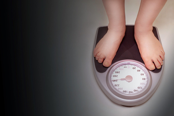 Young Healthy Girl On Home Scales Stock Photo - Download Image Now