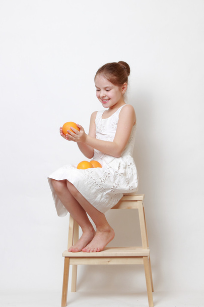 Kid holding eco orange - Foto, imagen