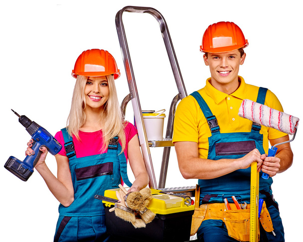 Couple builder  with construction tools. - Zdjęcie, obraz