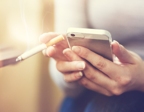 smartphone and cigarette - Photo, image