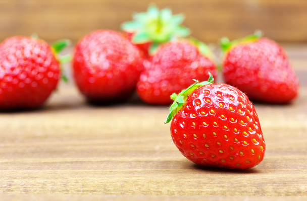 Fresh red ripe strawberries on wooden table. - Fotó, kép