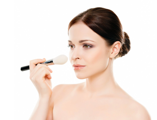 woman holding makeup brush - Valokuva, kuva