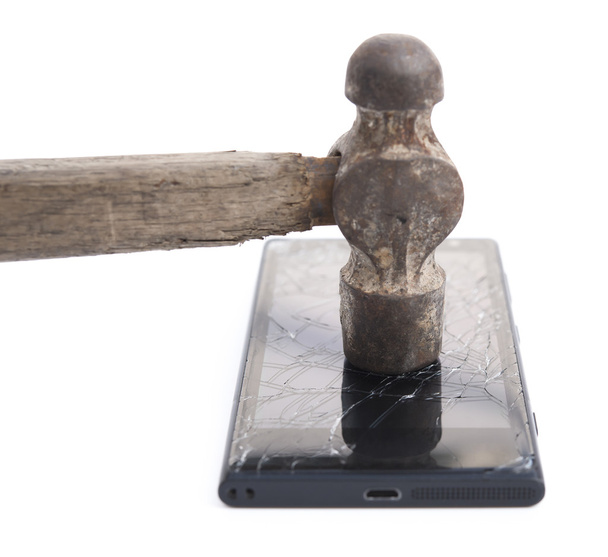 Kalapács, ütő egy mozgatható telefon - Fotó, kép