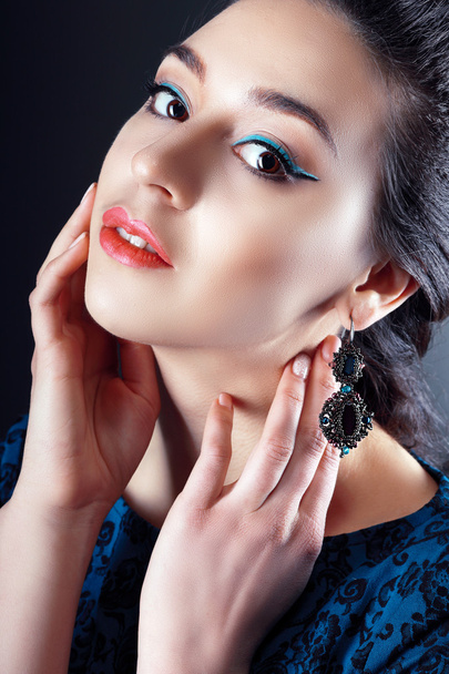 young woman wearing an earrings - Zdjęcie, obraz
