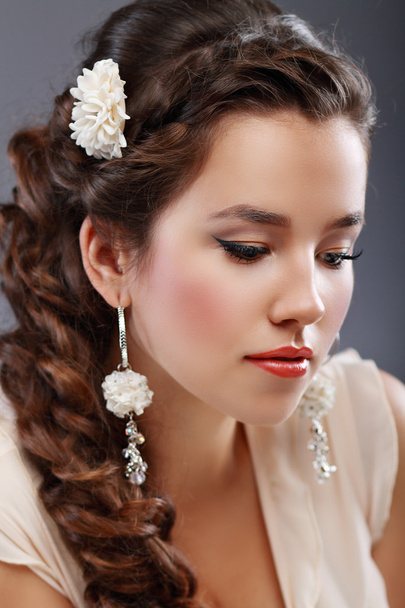 Beautiful  Woman with flower in hair - Fotó, kép
