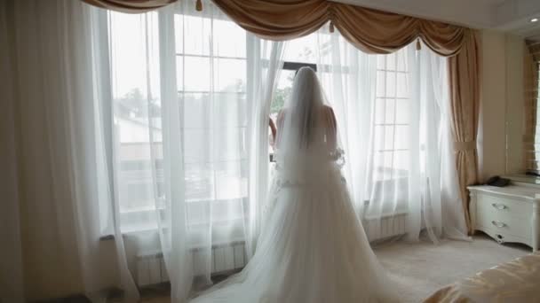 bride looking through the window - Footage, Video