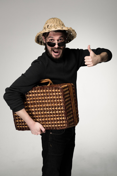 Young, attractive man  in sunglasses with  suitcase ready to travel  - Foto, immagini