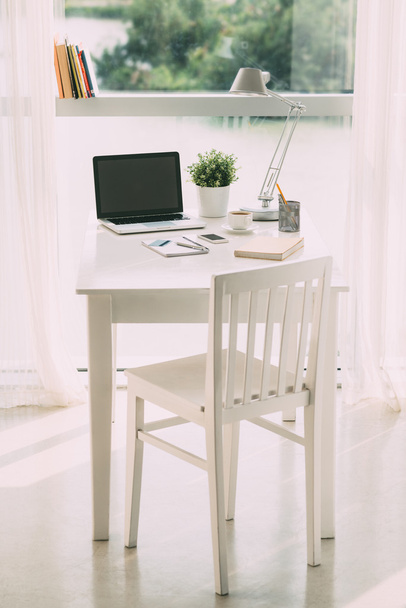 Stylish workplace with laptop - Фото, изображение