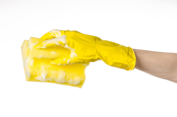 Cleaning the house and sanitation topic: Hand holding a yellow s - Φωτογραφία, εικόνα