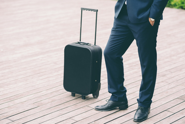 Legs of businessman and suitcase - Photo, Image