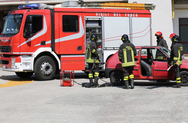 firefighters in action during a car accident - Photo, Image