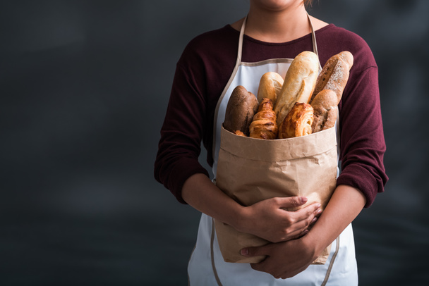 woman  with Bag with fresh bread - Фото, зображення