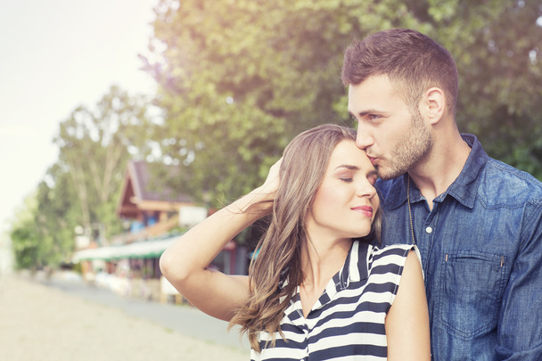Young affectionate couple outdoors - 写真・画像