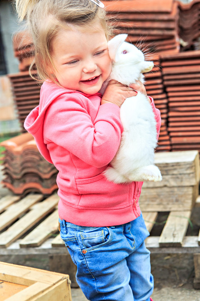 Little girl with a rabbit - Fotó, kép