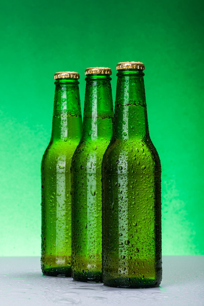 Three wet blank beer bottles - Foto, imagen