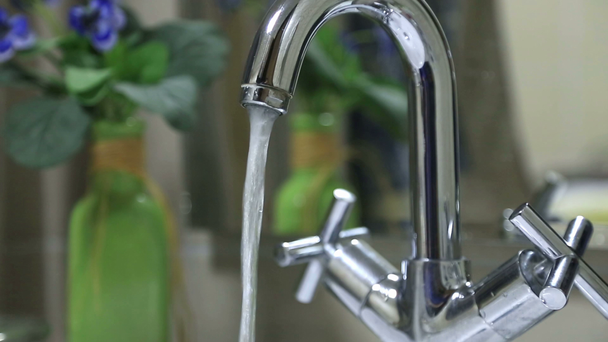 Water pouring out of  bathroom faucet - Footage, Video