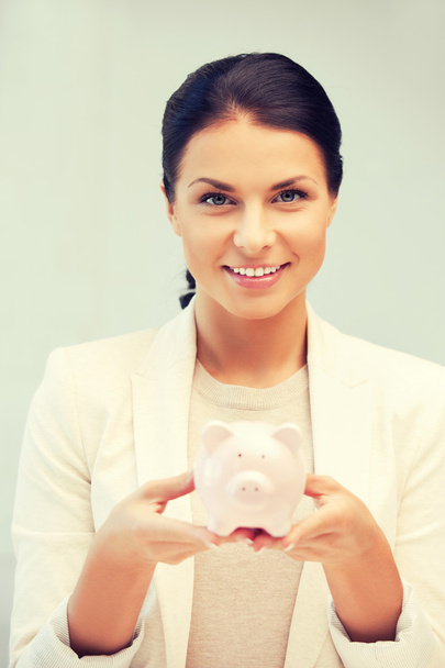 lovely woman with piggy bank - Foto, Imagen