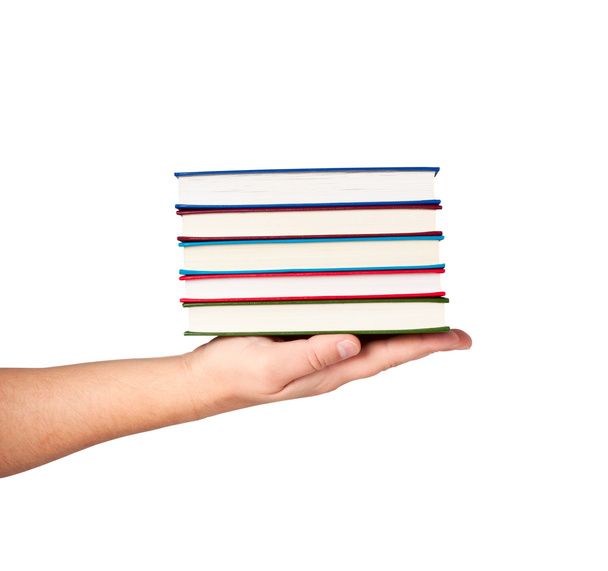 Books on hand isolated on white background. - Photo, image