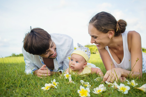 Happy family on grass - Photo, Image