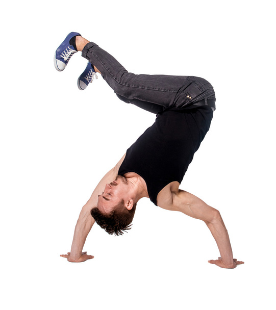 Break dancer doing handstand against  white background - Valokuva, kuva