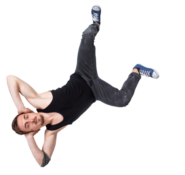 Break dancer doing one handed handstand against a white background - Photo, Image
