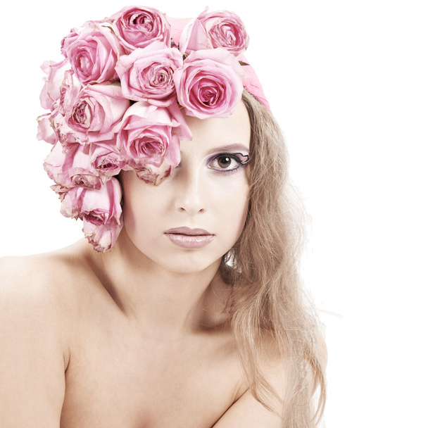 Young beautiful woman with pink flowers - 写真・画像