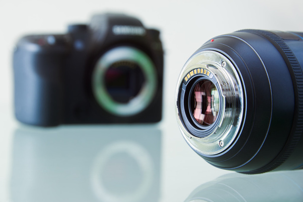 Closeup Of DSLR Photo Camera And Still Lens On Desk  - Photo, Image