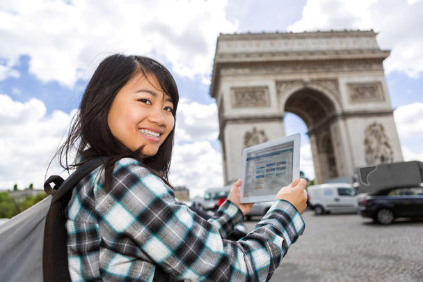 Young attractive asian tourist using tablet in Paris - Фото, зображення