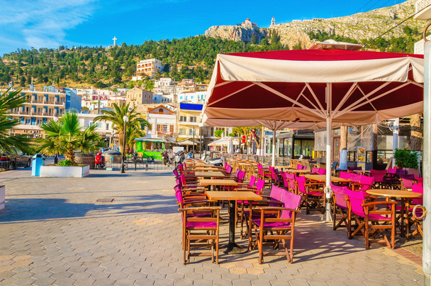 Purple chairs and umbrella in Greek restaurant - Photo, Image