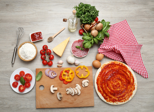 Food ingredients for pizza on table close up - Zdjęcie, obraz