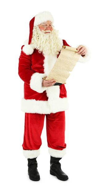 Santa Claus holding wish list, isolated on white background - Fotoğraf, Görsel