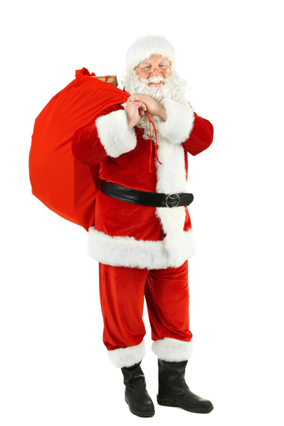 Santa Claus with bag, filled gift boxes isolated on white background - Photo, Image