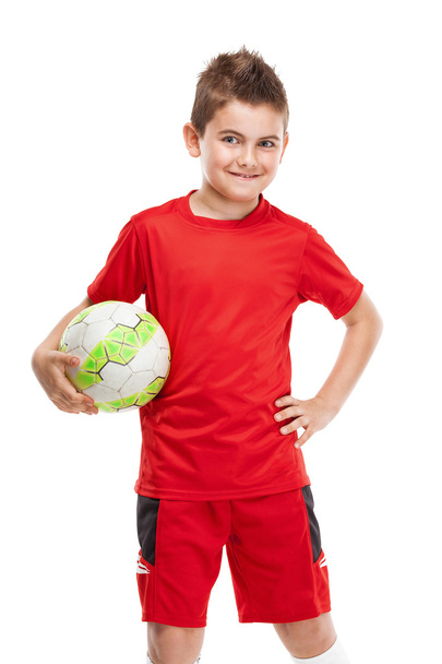 standing young soccer player holding football - Zdjęcie, obraz