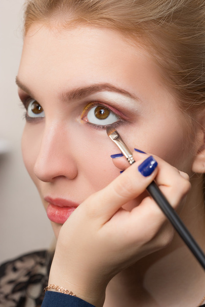 girl applied make-up on her eyes - Фото, изображение