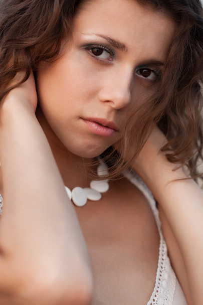 Closeup woman portrait with beads on neck - Foto, imagen
