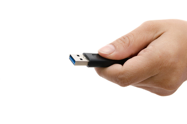 Hand holding black USB data storage  - Photo, Image