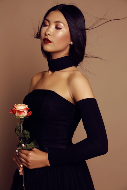 fashion studio portrait of beautiful asian girl with long hair wears elegant black dress - Zdjęcie, obraz