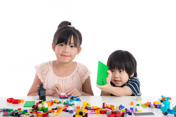 Little asian children  playing with colorful construction blocks - Photo, Image