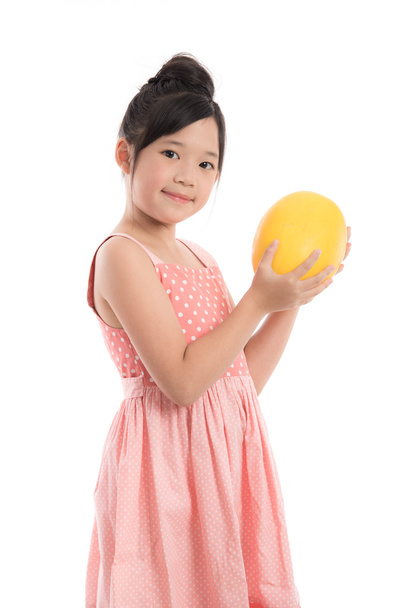 Little asian girl holding melon  - Photo, image