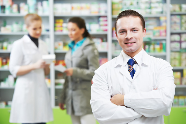 Confident pharmacy chemist man in drugstore - Foto, immagini