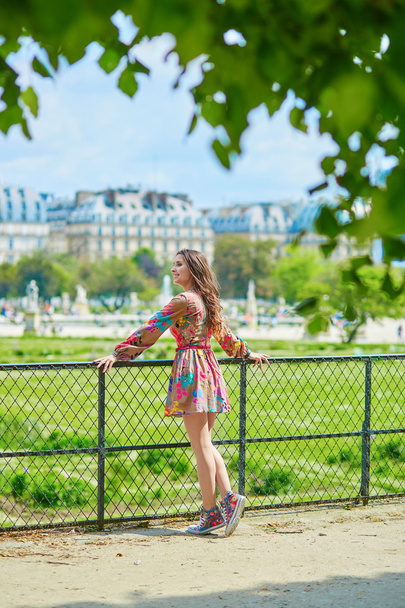 Beautiful young Parisian woman in Tuileries - 写真・画像