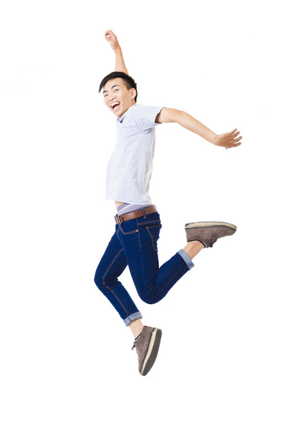 young happy man jumping and isolated on white - Foto, Imagen