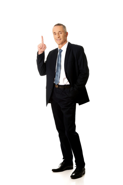 Businessman pointing upwards  - Photo, image