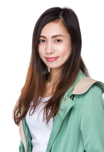 Młoda kobieta Azji w zielony płaszcz - Zdjęcie, obraz