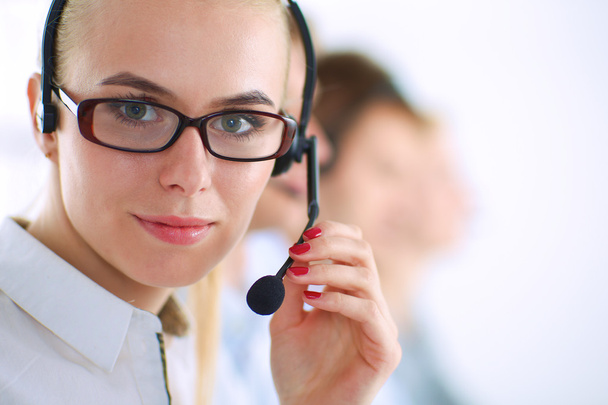 Attractive positive young businesspeople and colleagues in a call center office - Φωτογραφία, εικόνα