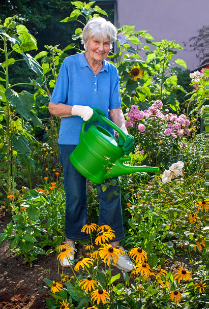 Senior Lady Watering Flowers - Φωτογραφία, εικόνα