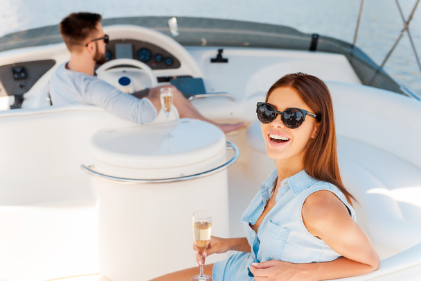 woman holding glass with champagne on yacht - Photo, Image