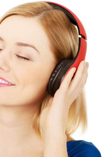 Woman with headphones listening to music.  - Photo, image