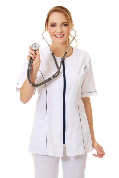 Young female doctor with stethoscope. - 写真・画像